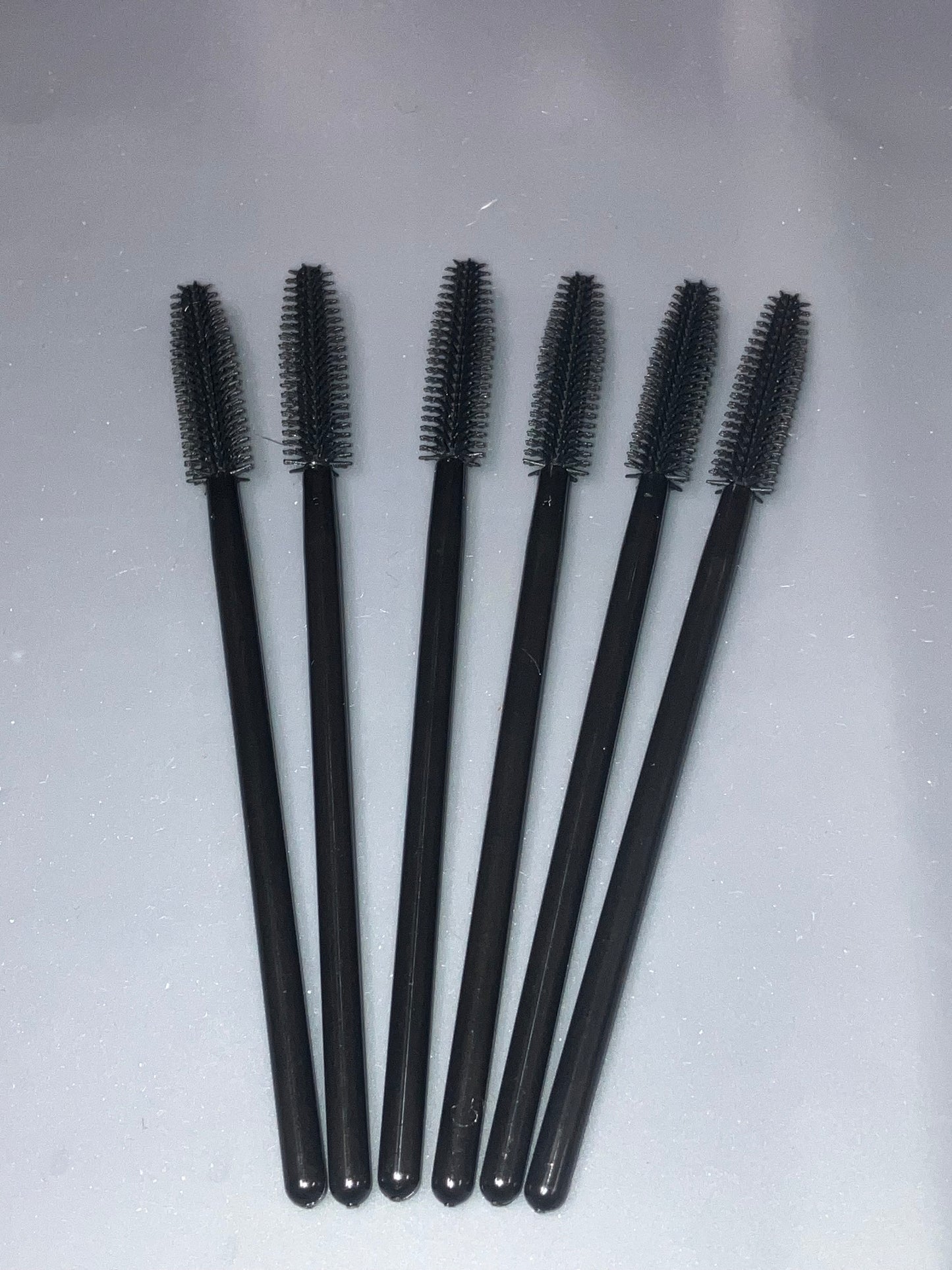 Mascara brush for cleaning sewing machine