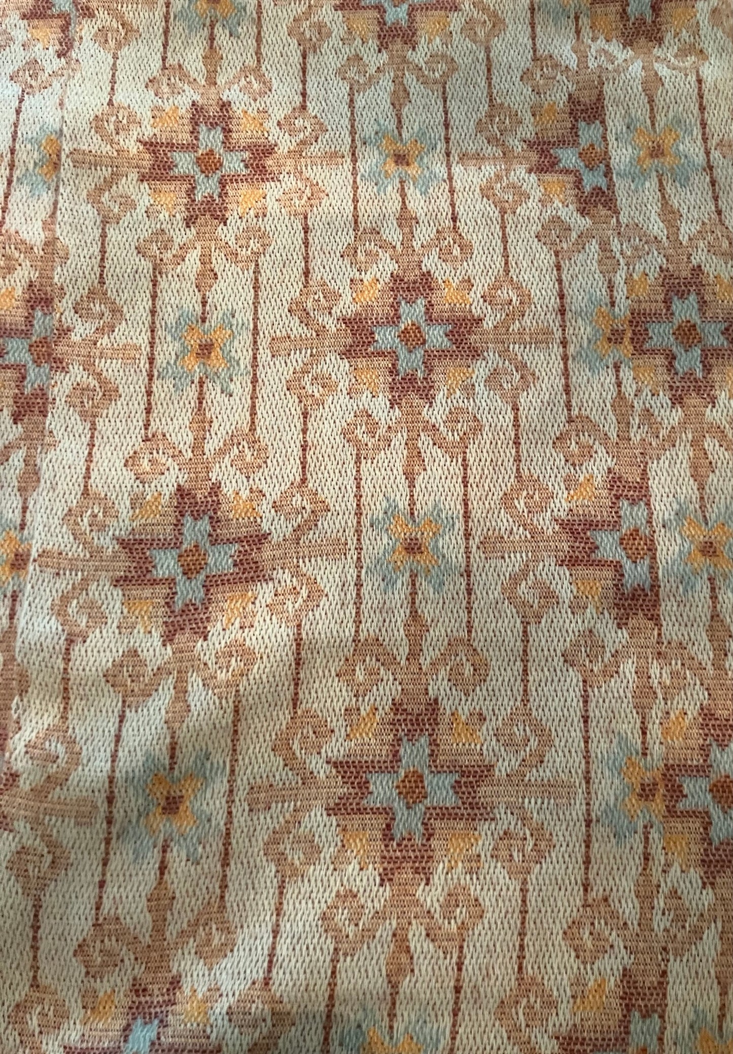 beige tan gold fabric with a cross design