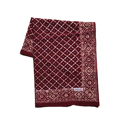 Maroon and beige patterned fabric on a white background