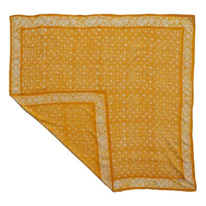 Yellow fabric with white pattern on a white background