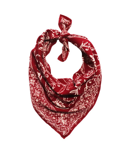Red bandana with white patterns on a white background
