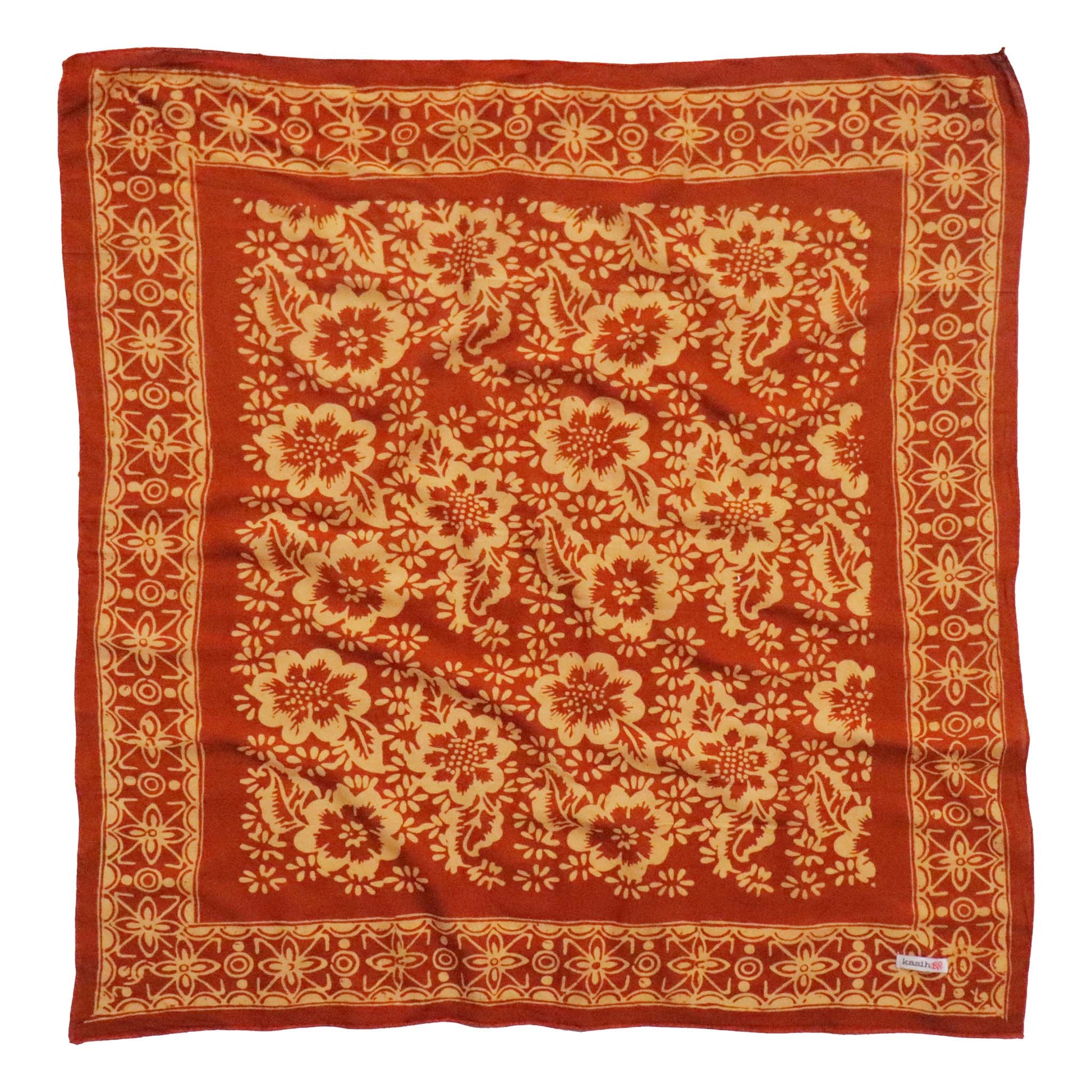 Red fabric with beige floral pattern on a white background